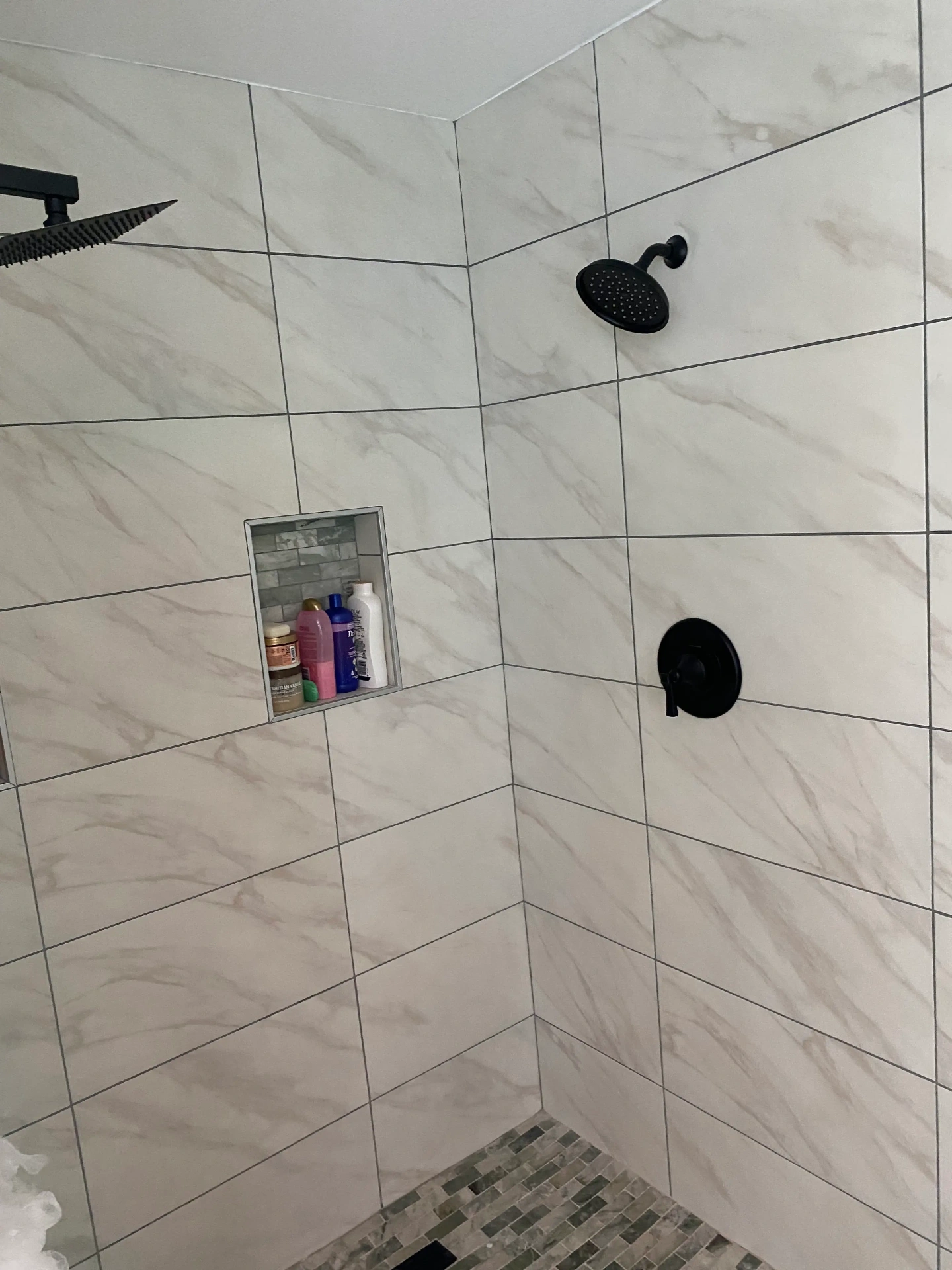 Marble tile shower with rainfall head