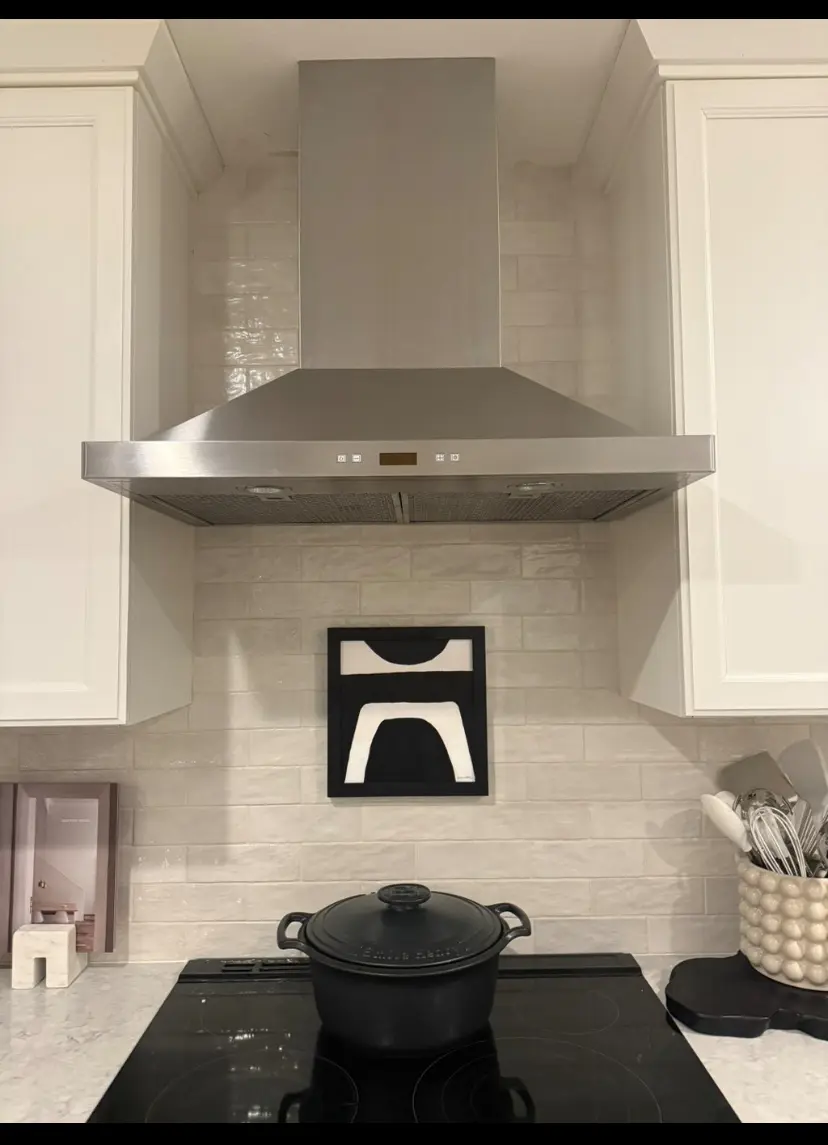 Stainless steel vent hood over kitchen range
